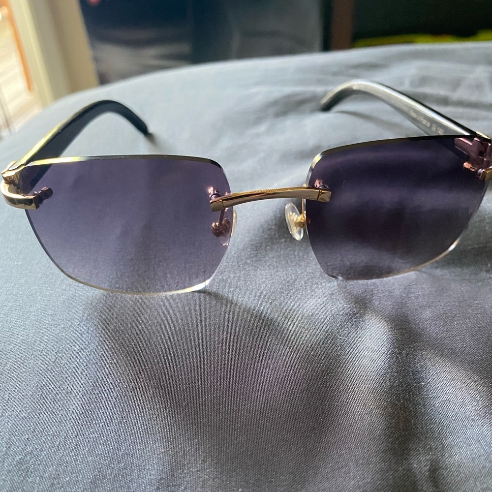 Cartier buffs gold trim black and white swirls